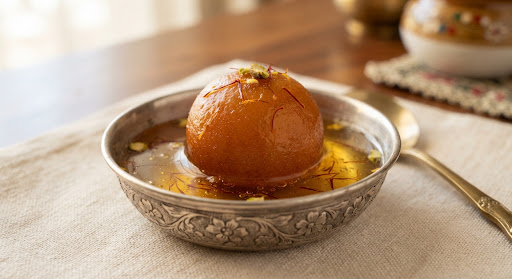 Gulab Jamun, golden milk dumplings in saffron syrup